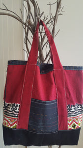 red tote bag with black accents