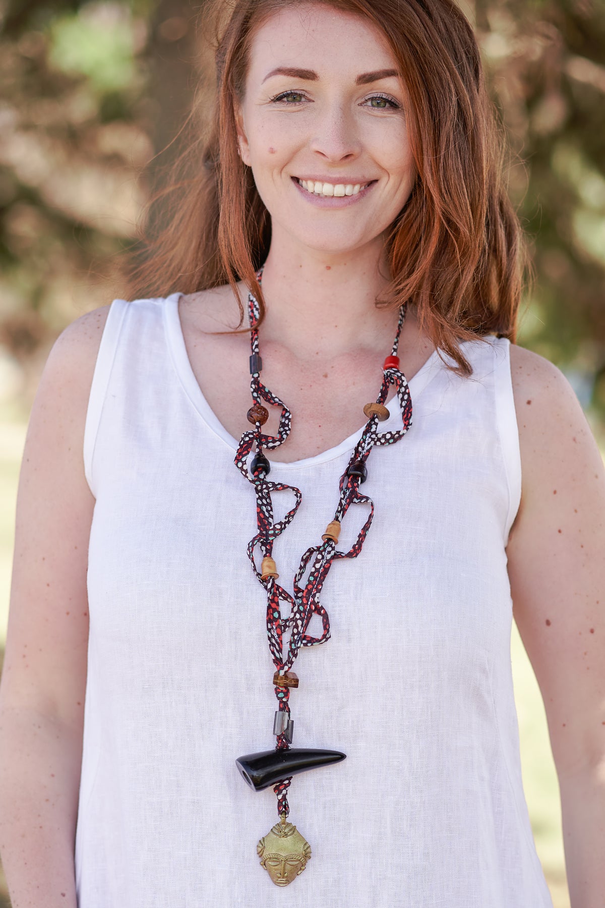 wearable art necklace in russet colour tones