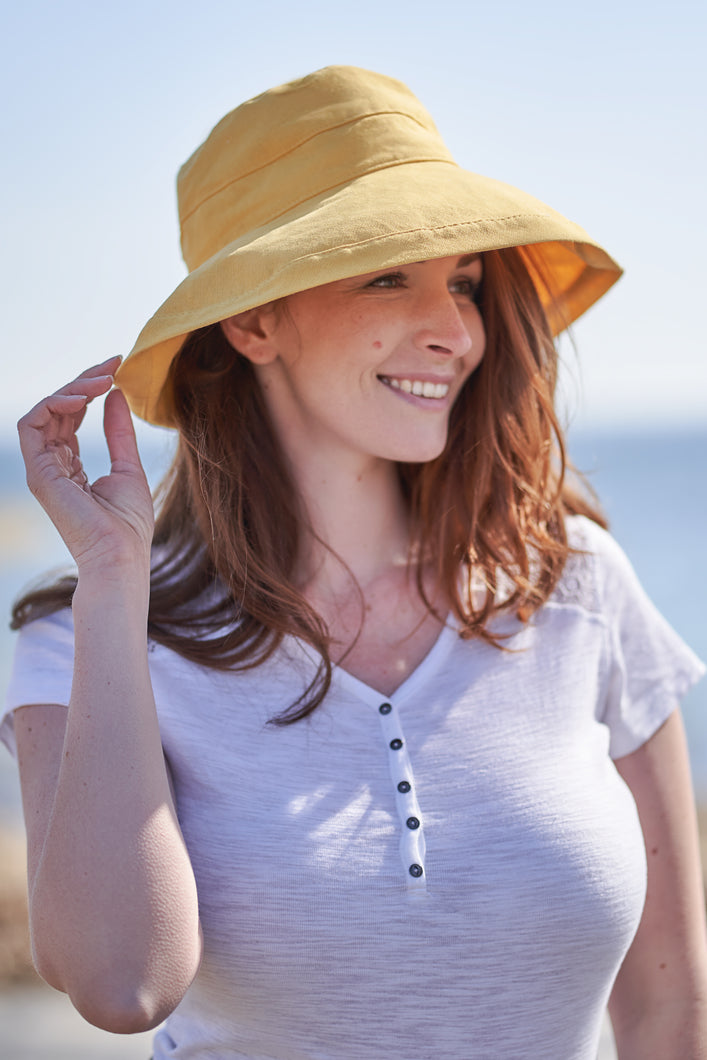 yellow brimmed hat