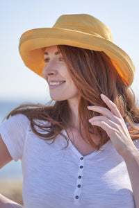 yellow brimmed hat