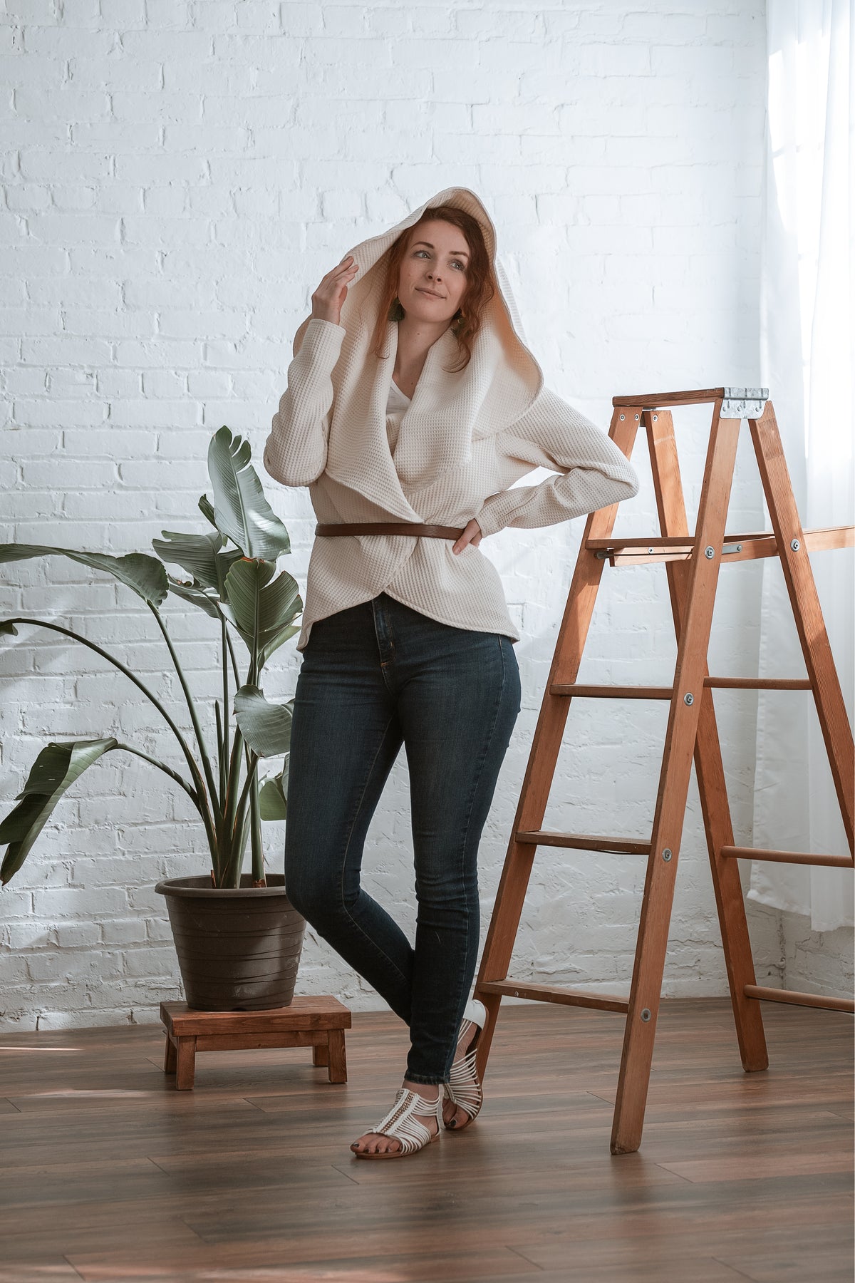 Creme circle jacket with belt and hood up